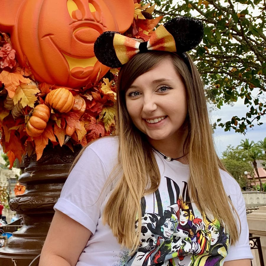 Cass at Magic Kingdom wearing candy-corn Minnie ears