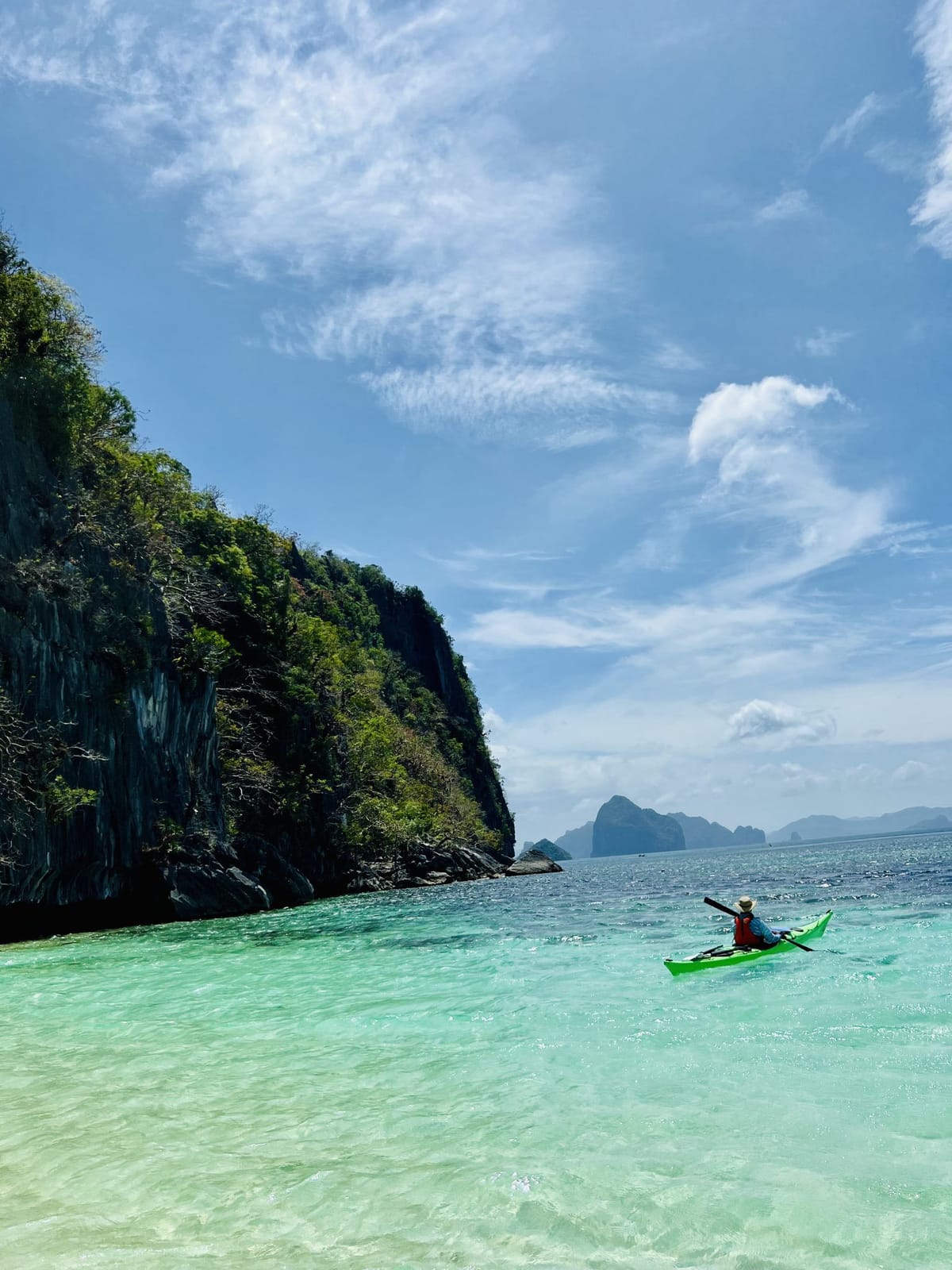 Kayaking a turquoise cove